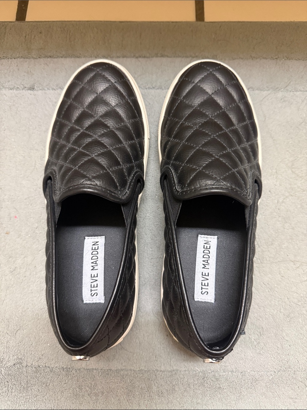 Steve Madden Black Quilted Slip-On Sneakers with White Sole